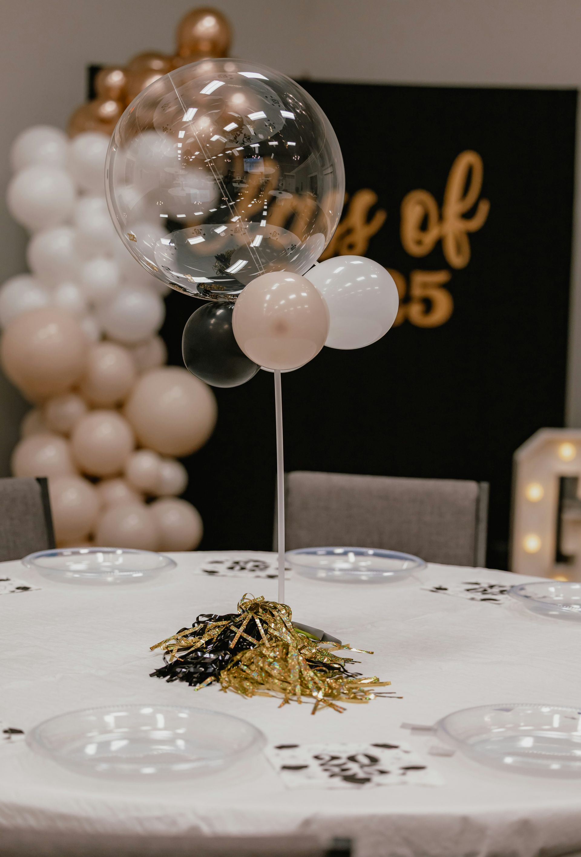 Balloon centerpiece decorates a party table setting.